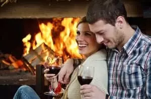 couple in front of a fire