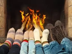 people with socks near the fire