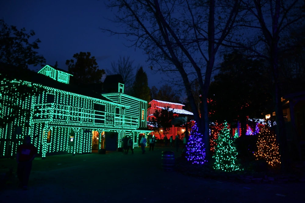 Christmas lights on buildings and Christmas trees at Dollywood's Smoky Mountain Christmas