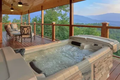 hot tub on deck with mountain view at Sunset Memories cabin in Gatlinburg